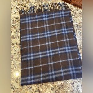 Dark brown measures 65” by 12”. 100% cashmere. Made in Scotland.